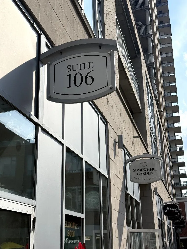 The Suite 106 sign at 191 King Street South, home of Chameleon Business Centres in Uptown Waterloo — the professional street address that signals an established business