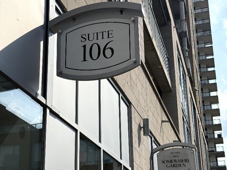 Suite 106 entrance sign at 191 King Street South